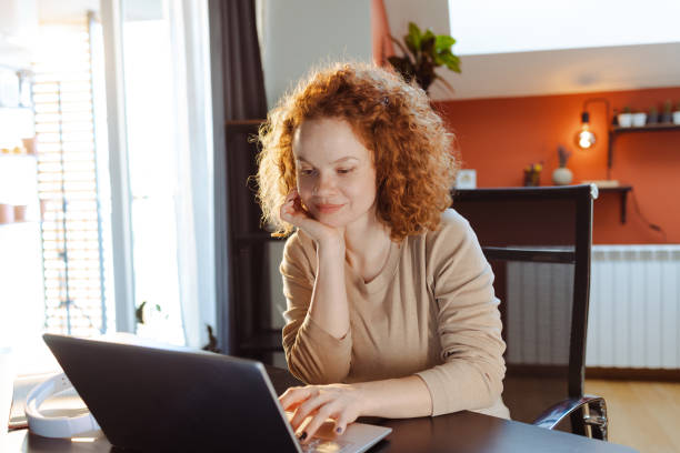 istock Concentrated woman working at home 1477055394