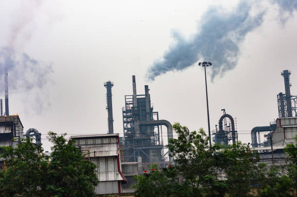 istock Smoke emission from factory chimney causing air pollution to the atmosphere. 1477057716