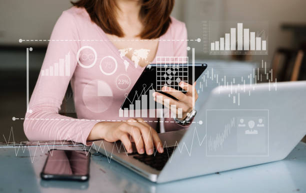 istock Businessman hand Project manager working and update tasks and Gantt chart scheduling virtual diagram.with smart phone, tablet and laptop in office. 1477061639