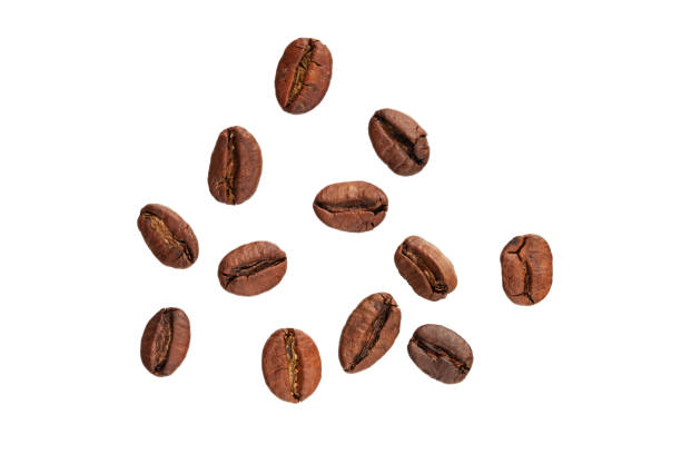 istock roasted whole arabica coffee beans, scattered on paper, isolated 1477067545