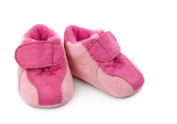 istock Pink baby shoes 147707085