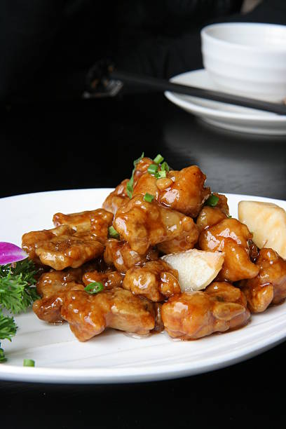A plate of delicious sweet and sour pork rids, taste of oriental.
