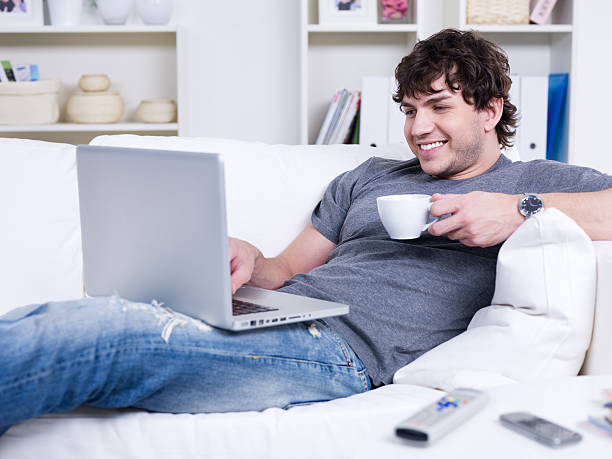 istock Man with laptop and cup of coffee 147707404