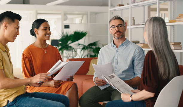 istock Documents, group or business people in meeting planning a creative startup project together with teamwork. Brainstorming, info or workers with paperwork for goals vision, b2b sales or strategy ideas 1477074699