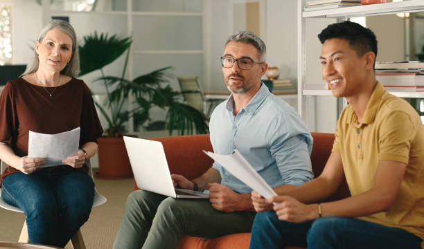 istock Documents, ideas or business people in meeting planning a creative digital startup project together. Teamwork, brainstorming or workers with paperwork for goals vision, b2b sales or group strategy 1477074720