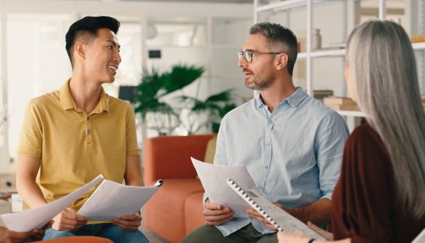 istock Startup documents or business people in meeting planning a creative group project in collaboration together. Teamwork, brainstorming ideas or workers with paperwork for our vision, strategy or goals 1477076021