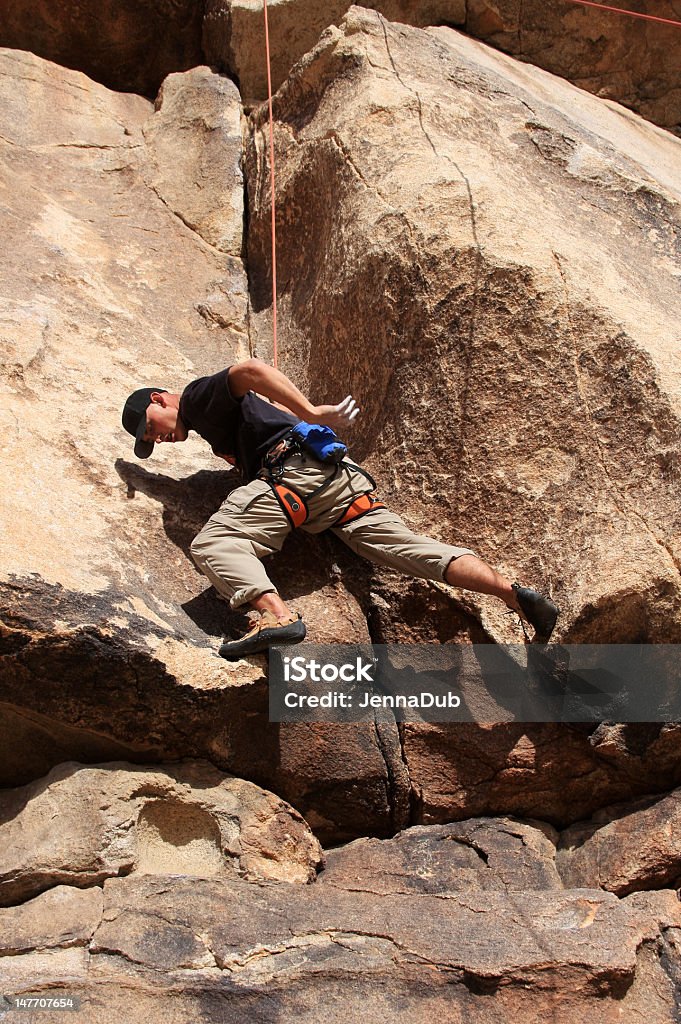 Young Male Rock Climber Young Male Rock Climber Top-Roping in Joshua Tree Adult Stock Photo
