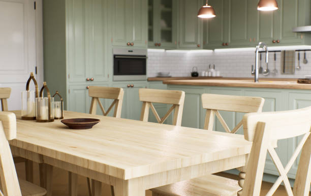 istock Green kitchen interior with island. Stylish kitchen with wooden worktops. Cozy olive kitchen with utensils and appliances. Close-up of a dining table in the background of the kitchen. 3D visualization 1477079062