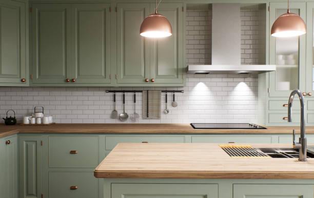 istock Green kitchen interior with island. Stylish kitchen with wooden worktops. Cozy olive kitchen with utensils and appliances. Close-up of a dining table in the background of the kitchen. 3D visualization 1477079068