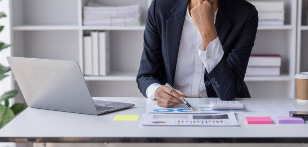 istock Businessman accounting working at office with calculator documents on his desk, doing planning analyzing the financial report, business plan investment, accounting finance analysis concept 1477079516