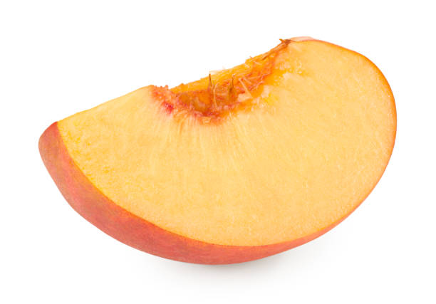 istock cut of peach fruit isolated on white background. clipping path 1477080686