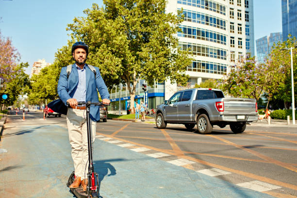 istock Businessman commuting to work on electric push scooter 1477081297