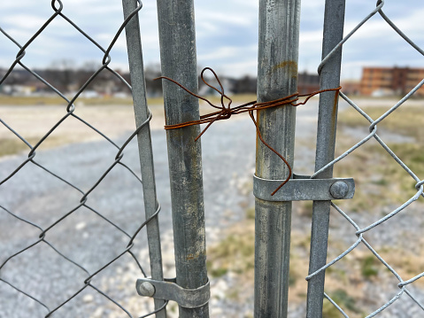 Rusty wire and chain link fence