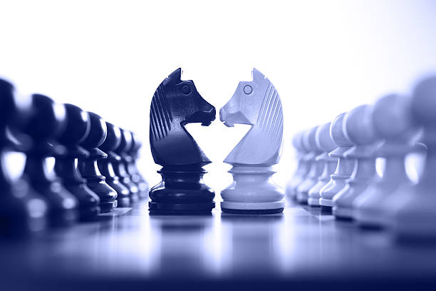 chess knight challenge chess knight challenge selective focus blue tone rivalry stock pictures, royalty-free photos & images