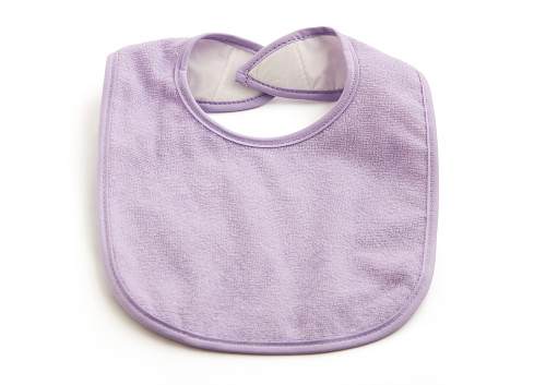A baby girl's purple bib, isolated on a white background. Clipping path included.