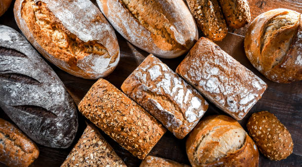 istock Assorted bakery products including loaves of bread and rolls 1477083038