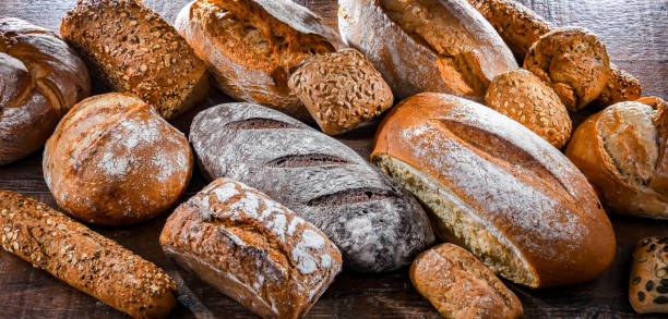 istock Assorted bakery products including loaves of bread and rolls 1477084415