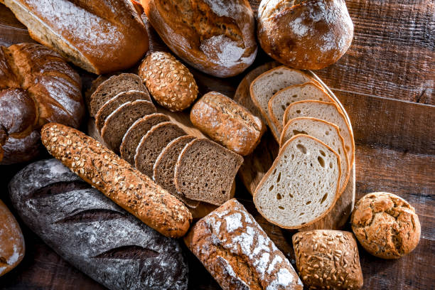 istock Assorted bakery products including loaves of bread and rolls 1477084474