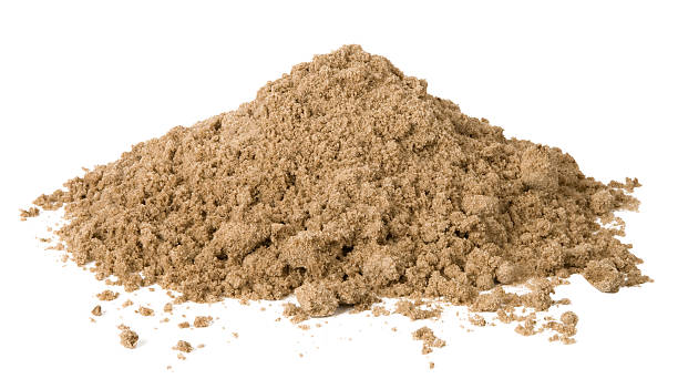istock Small pile of loose sand against white background 147708453