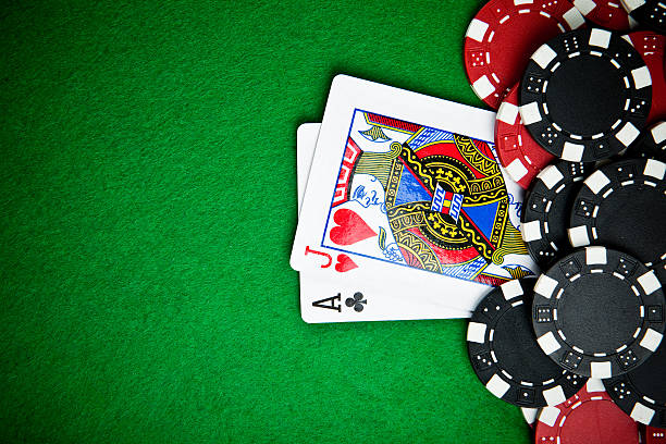 istock Black and red poker chips in the background. 147708521