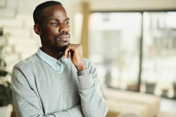 istock Thoughtful African American man at home. 1477085547