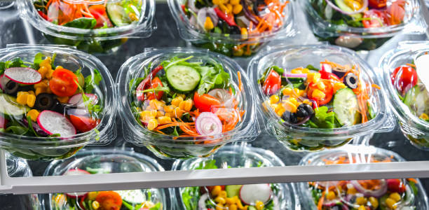 istock Boxes with pre-packaged vegetable salads in a commercial fridge 1477085561