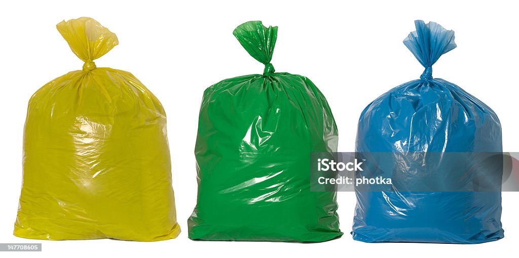 Rubbish ready for recycling Yellow, green and blue rubbish bags Garbage Bag Stock Photo