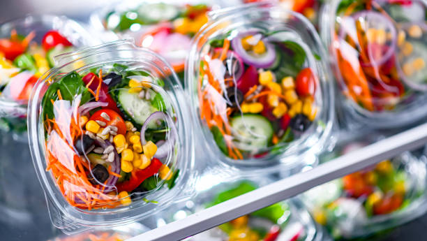 istock Boxes with pre-packaged vegetable salads in a commercial fridge 1477087654