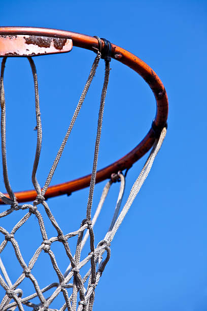 istock Basketball hoop isolated on blue sky 147708821