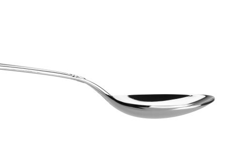 A spoon against a white background. Clipping path included for easy extraction.