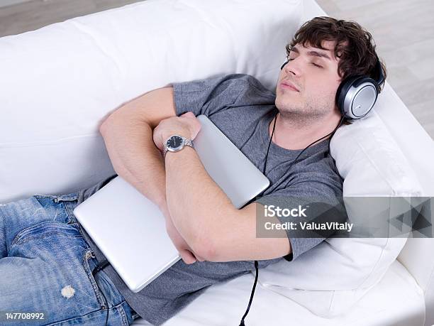 Sleeping Man With Headphone And Laptop Stock Photo - Download Image Now - 20-29 Years, Adult, Beautiful People
