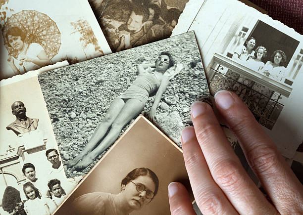 istock Hand touching old family pictures 147709140