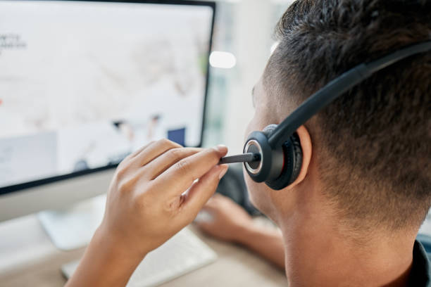 istock Microphone, computer us or call center consultant networking, talking or speaking of a financial loan policy. Contact us, telemarketing job or crm salesman in conversation with client on help screen 1477094032