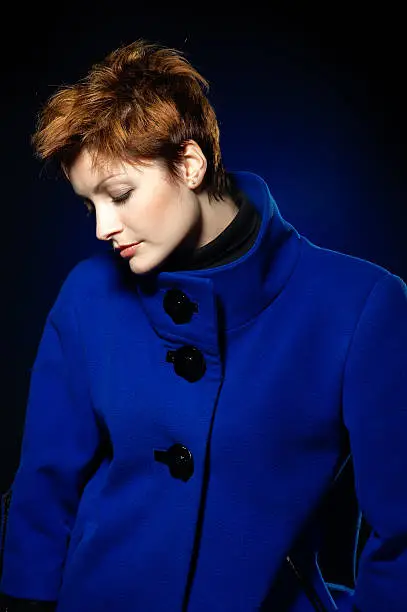 Photo of Lady in a blue topcoat