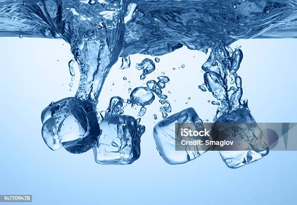 Ice Cubes Dropped Into Water Stock Photo - Download Image Now - Blue, Bubble, Clean