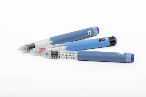 Out of Insulin - Empty Blue Insulin Pens for Diabetes Treatment - Deductible too high stock photo