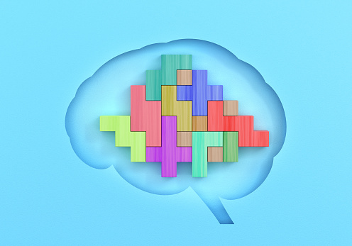 Brain Shape And Block Puzzle Concept On Blue Background