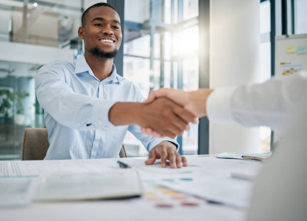 istock Hiring, designer or black man shaking hands with human resources manager for a successful job interview in office. Handshake, meeting or worker with a happy smile for a job promotion or business deal 1477103613