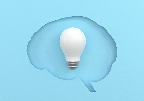 Brain Shape And Light Bulb Concept On Blue Background