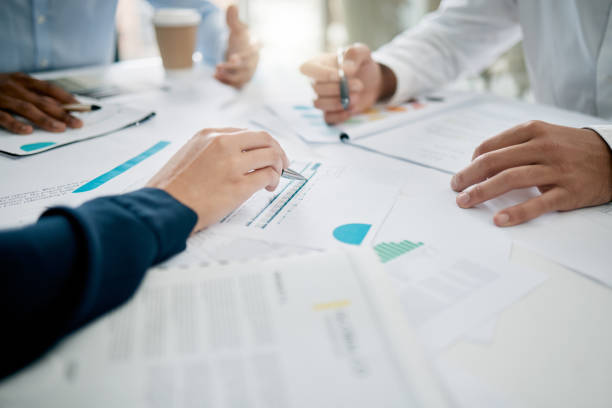 istock Strategy, planning and hands on documents for tax audit report or financial statement for startup business. Accounting, paperwork and meeting for finance target, goals or research analysis in office. 1477104540