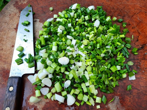 Cutting and Chopping Green Onion vegetable - food preparation.