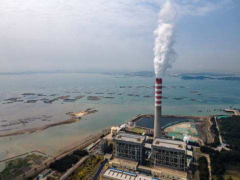 Aerial view of a thermal power plant by the sea