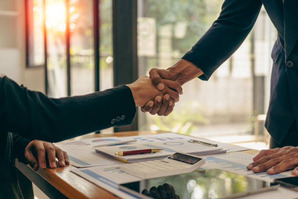 istock Two confident businessmen shaking hands during meeting in office Successful collaboration and contact Greetings and Partnerships in the Real Estate Business 1477109058