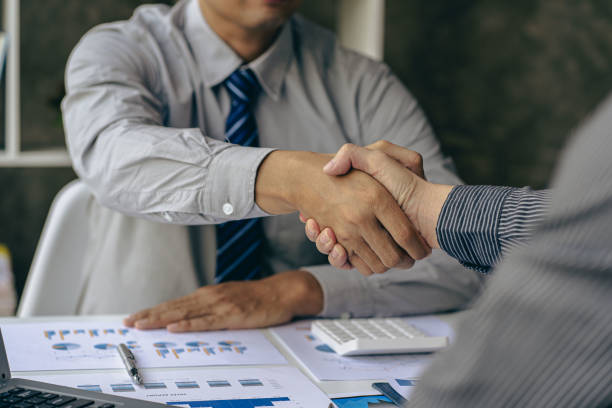 istock Two confident businessmen shaking hands during meeting in office Successful collaboration and contact Greetings and Partnerships in the Real Estate Business 1477109126