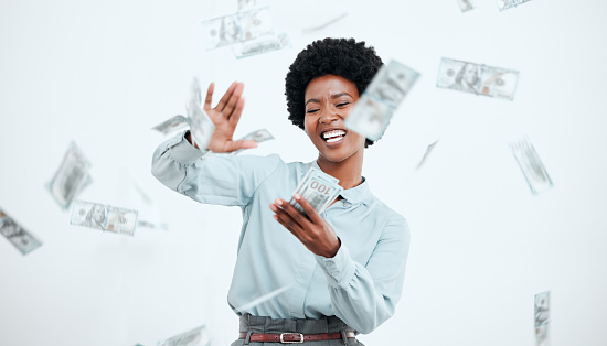 Money, cash and business black woman in studio wealth, bonus and investment success with finance, profit and savings. Lottery, winner and salary of an african corporate employee for financial freedom