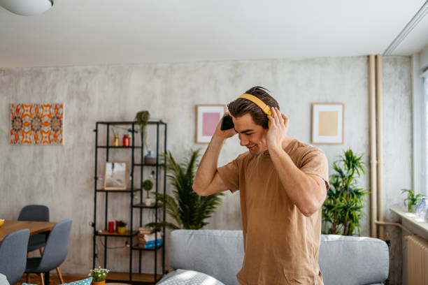 istock Young Man Singing And Dancing At Home 1477112362