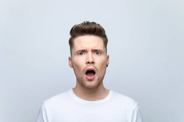 istock Displeased young man staring with mouth open 1477115885