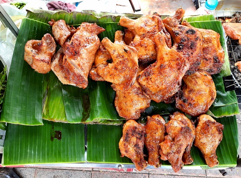 Chicken BBQ on market vendor - Bangkok street food.