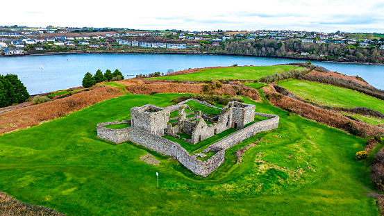 Aerial view of old ruin structure, Kinsale, Ruins of James Fort Ireland, Historical monastery, James Fort, Co. Cork, Ireland, View of green hill,Aerial view of James fort Kinsale Ireland, Charles Fort Kinsale, Stone building left in Ruin