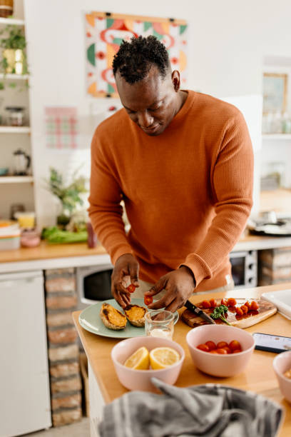 istock Man preparing healthy homemade meal 1477120052